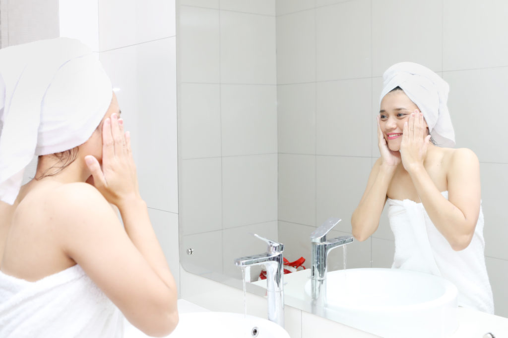 Best Body Scrubber, woman washing face